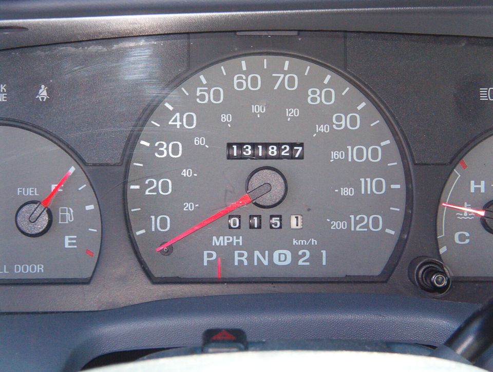 Instrument cluster close-up showing 131,827-mile odometer, speedometer, fuel gauge near full, and PRND21 indicator in D