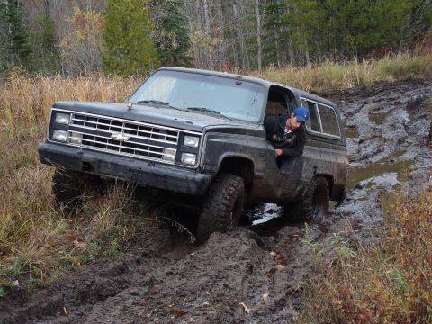 1988 Chevrolet Blazer - A driver navigates a muddy trail in a 1988 Chevrolet Blazer.