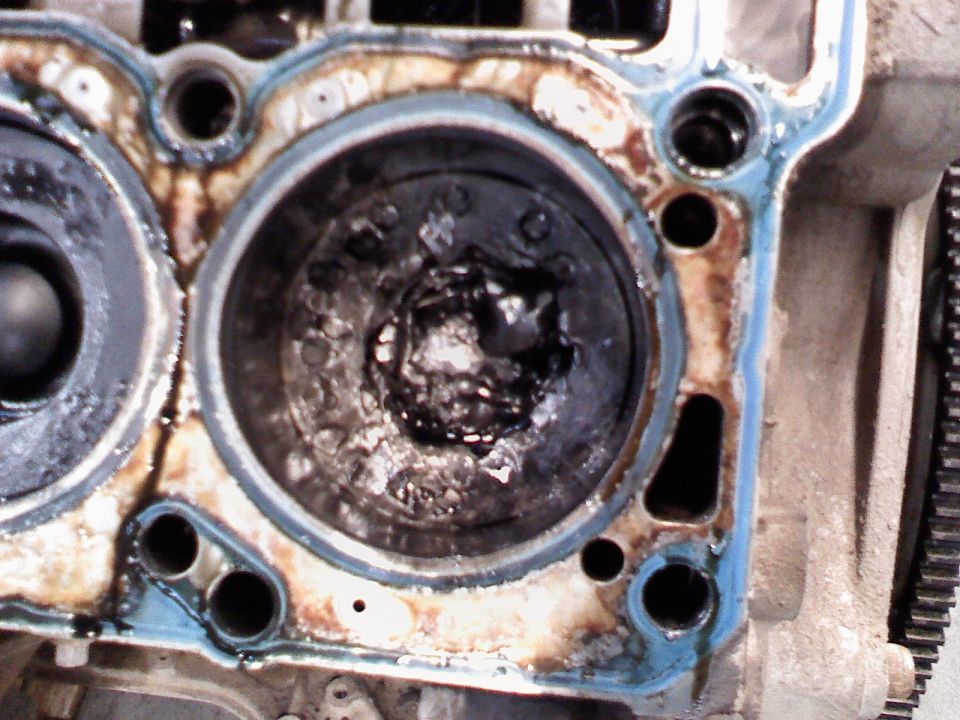 Damaged engine cylinder with debris inside