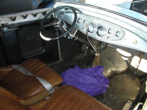1998 Ford Crown Victoria - Interior view of a custom hot rod, leather seats and a unique dashboard with multiple gauges.