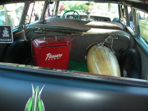 1998 Ford Crown Victoria - Vintage station wagon interior with a cooler and drum. The dashboard and steering wheel are visible.