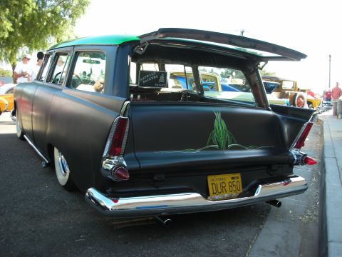1998 Ford Crown Victoria - Modified station wagon with custom paint and lowered stance parked on a street.