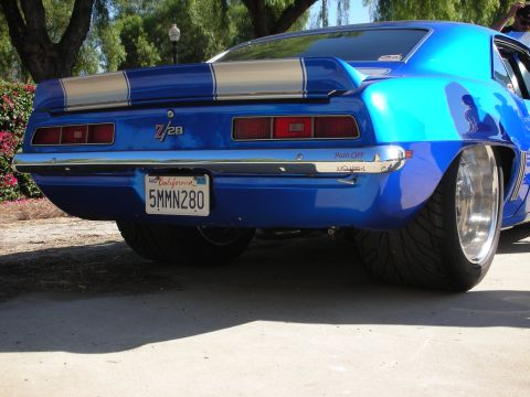 1998 Ford Crown Victoria - A modified 1969 Chevrolet Camaro Z/28 displays its custom rear end and wide tires.