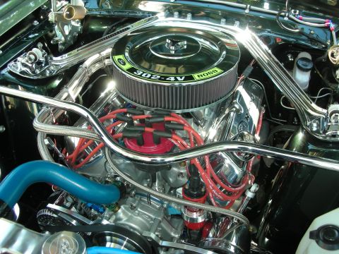 1998 Ford Crown Victoria - Close-up of a highly polished engine bay a "302-4V BOSS" air cleaner and red spark plug wires.