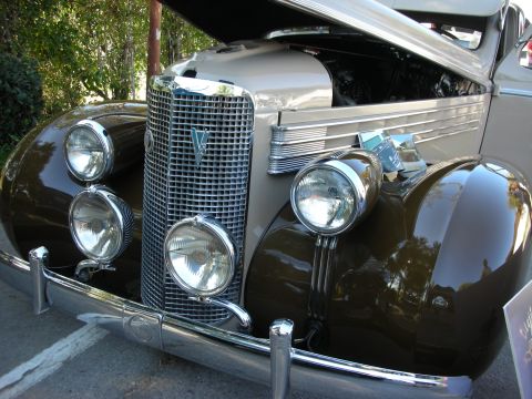 1998 Ford Crown Victoria - Close-up of a classic car's front end, showing its distinctive grille and headlights.