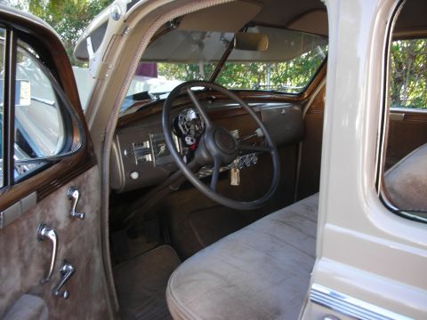 1998 Ford Crown Victoria - The interior of a classic car, a large steering wheel and a simple dashboard.