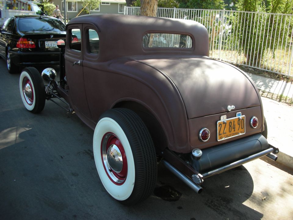 Hot rod coupe with whitewall tires and a California plate