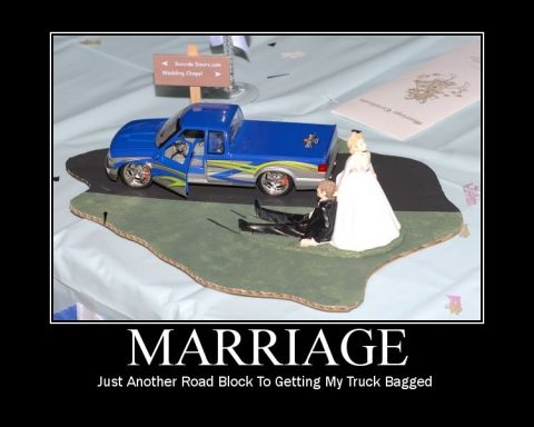 2006 Ford E350 - A humorous diorama depicts a toy truck and wedding toppers, with a sign for 'Suicide Doors.com Wedding Chapel'.
