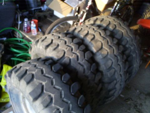 stack of large off-road tires