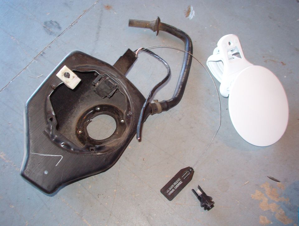 I picked these up before I totalled my '99 P71, so it's time to install them.  I scuffed the dark purple paint with a 2-grade sanding sponge, wiped it down with Acetone, shot a few coats of cheap gloss white on, let it dry overnight, then baked it for ~30min @ 225F.  I think it'll be pretty close.