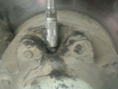 1992 Ford F-350 - Detail of a wheel hub assembly, likely from a truck, showing a grease fitting and mounting points.