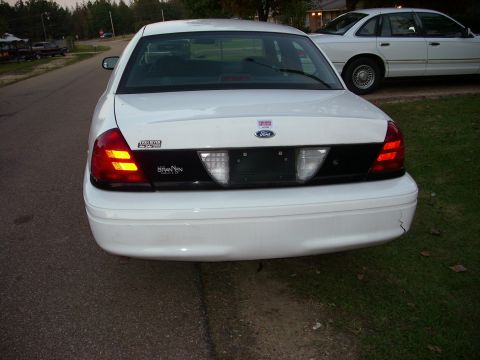 2001 Ford Crown Victoria - This 2001 Ford Crown Victoria has a black panel between its taillights and a Ford badge on the trunk lid.