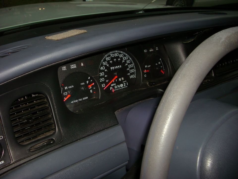 2001 Ford Crown Victoria dashboard showing speedometer, fuel gauge, and voltmeter