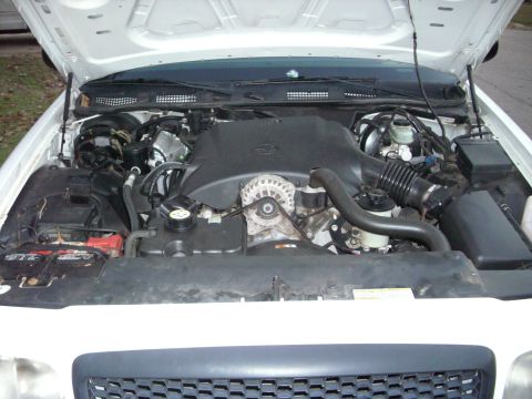 2001 Ford Crown Victoria - The engine compartment of a 2001 Ford Crown Victoria is shown with the hood open.