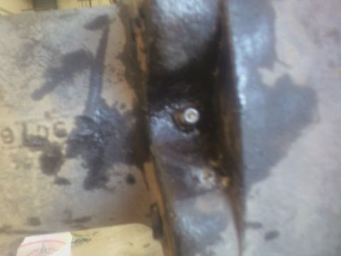 1992 Ford F-350 - Metal casting part with visible bolt and partial text '9 LbC'.
