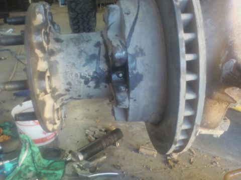 1992 Ford F-350 - A close-up view of a heavy-duty truck's brake rotor and hub assembly, showing mechanical components.