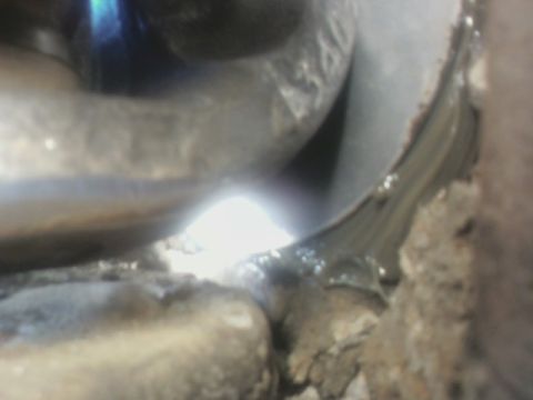 1992 Ford F-350 - A close-up view of a greasy, metallic component, possibly from a vehicle's undercarriage.
