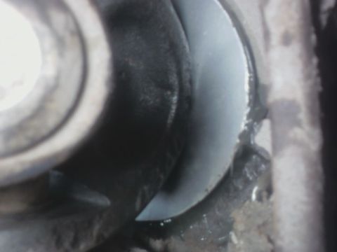 1992 Ford F-350 - Detail of a wheel hub assembly, a light gray plastic cover over the metal components.