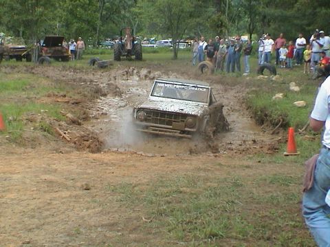 1972 Ford Bronco - A Ford Bronco churns through mud during an off-road event.