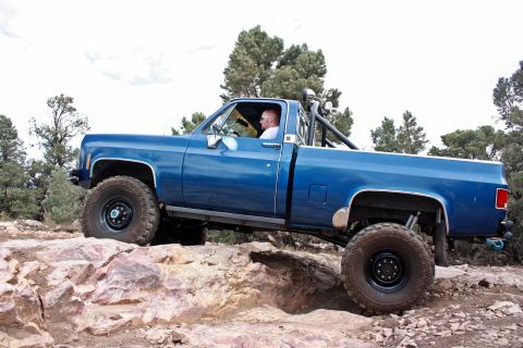 1979 Chevrolet C/K Pickup - This blue 1979 Chevrolet C/K Pickup is shown navigating a rocky off-road trail.