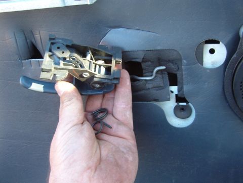 1998 Mercury Grand Marquis - I drilled the rivet flare off, pulled it out, dumped out the broken spring, dropped in a similar one (I have a LOT of junk), & pushed the r…