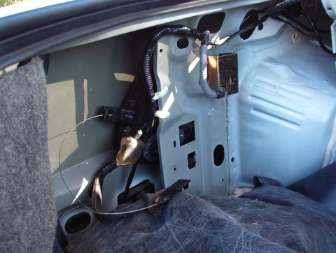 1998 Mercury Grand Marquis - The powered cup goes right back in the same way. The gold metal shield protects the inertia fuel shutoff (IFS) switch.