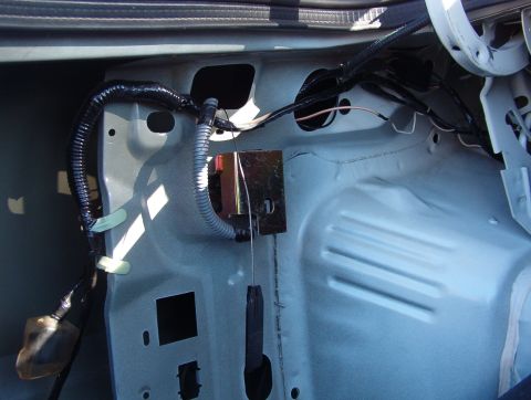 1998 Mercury Grand Marquis - Everything is in place & working. I drilled a new ground screw in the shadow above the wiring harness. The gold metal shield protects the i…