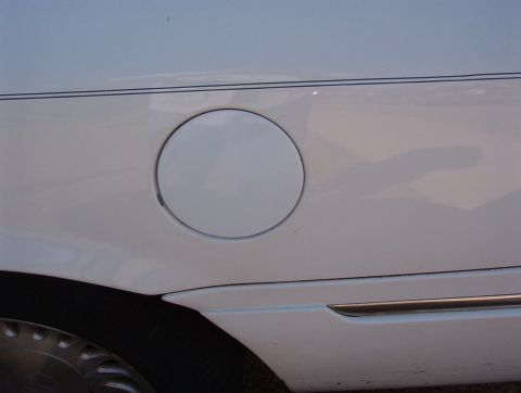 1998 Mercury Grand Marquis - It even works! That little rub spot has since been touched up. The ~6-year-old can of ultra-cheapo Wal-Mart gloss white spray is a pretty g…