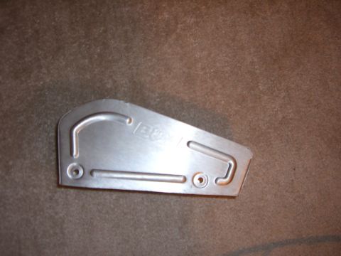 1988 Ford Bronco - This metal bracket has an embossed logo and mounting holes.