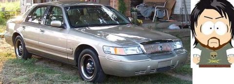 2000 Mercury Grand Marquis - A gold 2000 Mercury Grand Marquis is parked outside a residence.