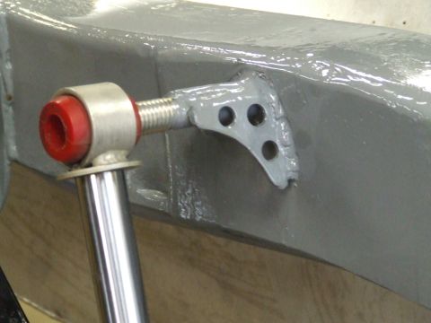 1967 Ford Bronco - Shock absorber mount detail on a vehicle frame, likely during restoration or modification.