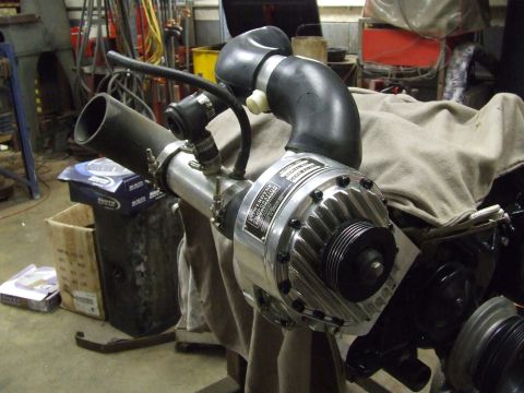 1967 Ford Bronco - A close-up view of a supercharger assembly, likely for an engine upgrade.