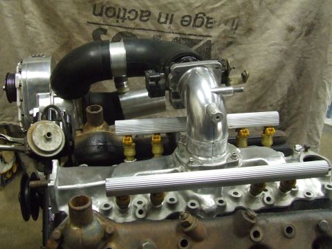 1967 Ford Bronco - Engine components, including a supercharger and intake manifold, are shown in a close-up view.