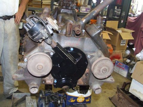 1967 Ford Bronco - Close-up view of an engine block, a distributor and a freshly painted black cover.