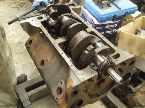 1967 Ford Bronco - This image shows an engine block with its crankshaft exposed, likely undergoing repair or inspection.