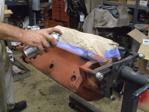 1967 Ford Bronco - Engine block being prepped for paint in a workshop setting.