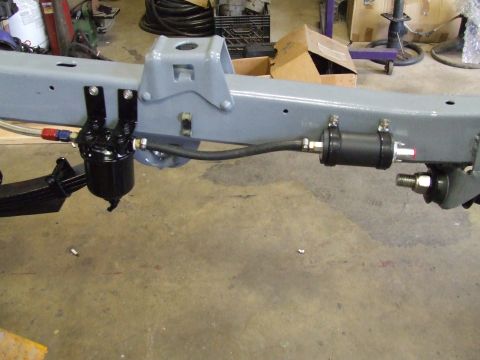 1967 Ford Bronco - Close-up of a vehicle's frame showing the fuel filter and associated plumbing during a restoration or build.