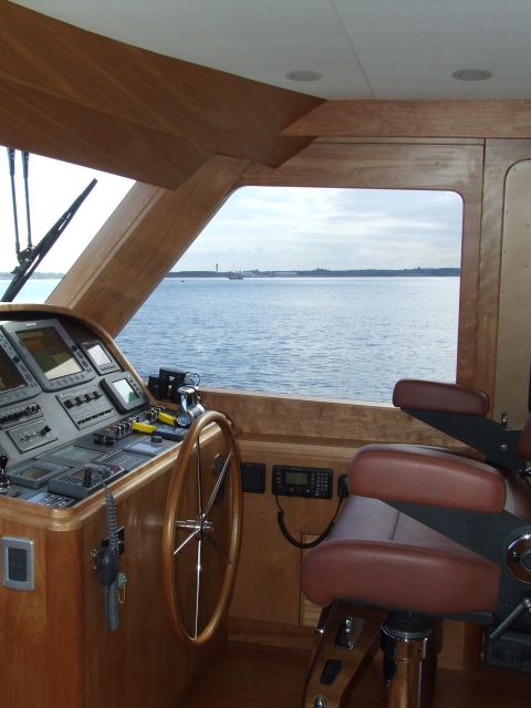 1976 Ford F-150 - Interior view of a yacht's helm station, showing navigation equipment and a view of the sea.