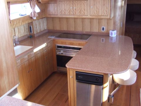 1976 Ford F-150 - This boat galley features a compact kitchen setup with modern appliances and ample counter space.