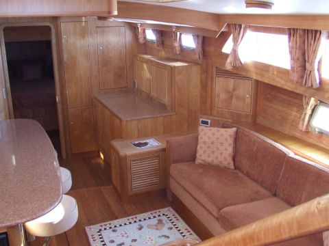 1976 Ford F-150 - Interior view of a yacht's cabin, showing a seating area and wooden finishes.