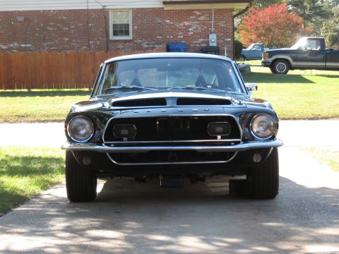 1968 Shelby GT500 - Front view of a black 1968 Shelby GT500 parked in a driveway.