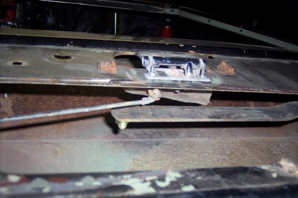 Tailgate latch mechanism with rust and peeling paint