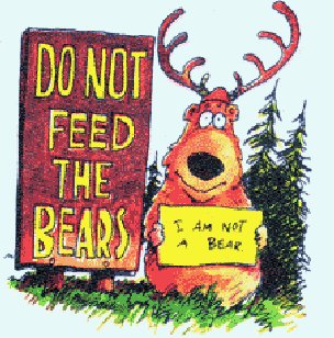 1996 Ford Bronco - Reindeer holding a sign stating 'I AM NOT A BEAR' next to a park sign.