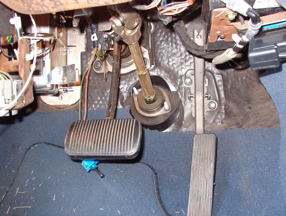 Vehicle floor pedals and steering column shaft viewed from below