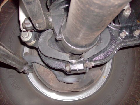 1978 Ford Bronco - Close-up of vehicle undercarriage components, including suspension and tire.