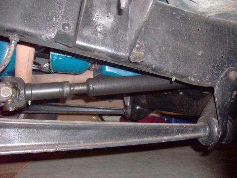 1978 Ford Bronco - Close-up view of the drivetrain and frame components of an unidentified vehicle.