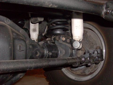 1978 Ford Bronco - Underside view of a vehicle's rear axle, suspension, and shock absorber system.
