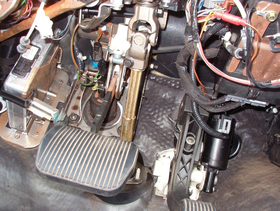 I disconnected the drive cable before installing the new pedals, and it was much easier to get them into place than last time (on my '99). The BOO & cruise cancel switches were never unplugged - just removed from the brake assembly & reinstalled. The power wire to the switch (Bk/W) is soldered to the output wire (Y/LG) from the power window circuit breaker, and all 3 grounds go to the LCM bracket. I tapped the O/Bk wire coming out of the LCM & added a connector just in case. I haven't decided if I'll mount the switch, and if so, where. I might leave it loose so she can set it, then tuck it out of the way so no one changes it. But the wires are long enough to reach almost anywhere that I might want to put it.