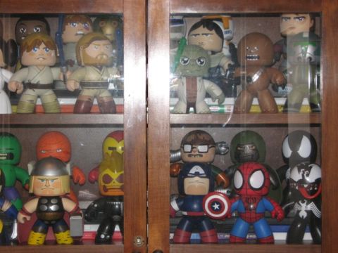 1991 Ford Bronco - A display cabinet filled with various superhero and Star Wars character figurines, including Captain America, Spider-Man, and characters fr…