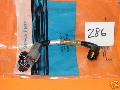 1992 Ford Bronco - A new Ford Service Parts wiring pigtail harness still in its orange and blue parts bag, with a gray two-pin connector on one end and a blac…